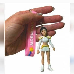 White and Gold Keychain Figure with Pink Strap